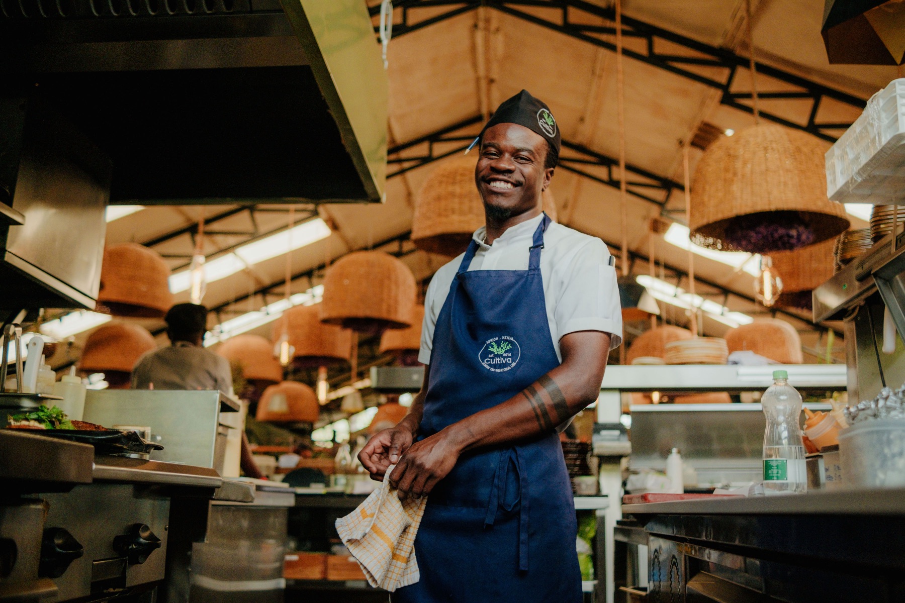 Voices Unseen — the chef at Cultiva Kenya in the open kitchen
