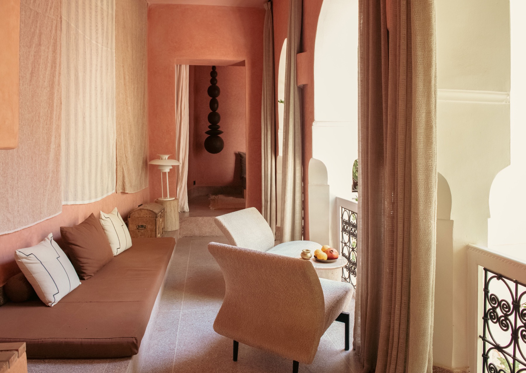 Riad Brummell Medina — the terracotta lounge opening onto the arched balcony